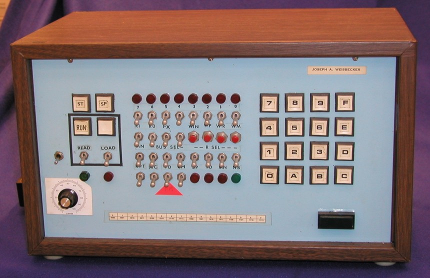 System 00 front panel, with a hex keypad and rows of toggle switches, buttons, and lights.